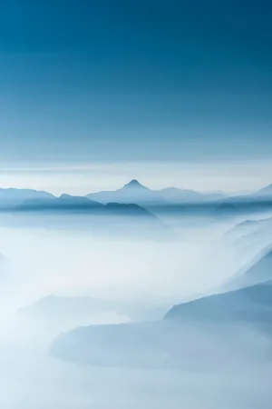 Hd Mountain Range In Clouds Wallpaper