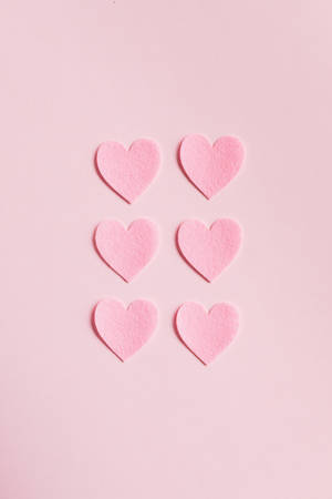 Hearts On Pink Background Wallpaper