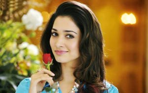 Heroine Actress Holding A Rose Wallpaper