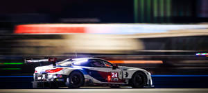 High-speed Pursuit In Auto Racing Wallpaper