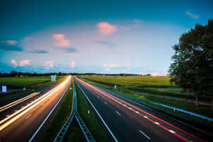 Highway With Two Converging Roads Wallpaper