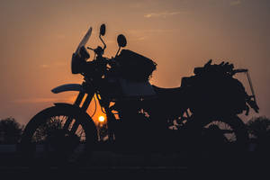 Himalayan Bike And Sunset Wallpaper