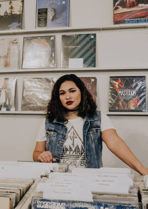 Hipster Female In Record Store Wallpaper