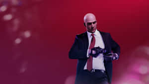 Hitman Agent 47 Holstering A Gun Wallpaper