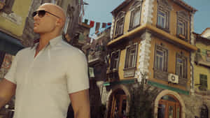 Hitman Agent 47 Passing By Traditional Houses Wallpaper