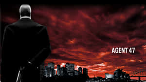 Hitman Agent 47 Watching Over A City Wallpaper