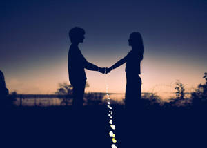 Holding Hands Silhouette On Gradient Sky Wallpaper