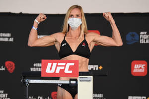 Holly Holm Flexing Biceps Wallpaper