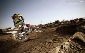 Honda Dirt Bike About To Fall Wallpaper