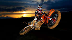 Honda Dirt Bike Jumping Posing Sunset Wallpaper