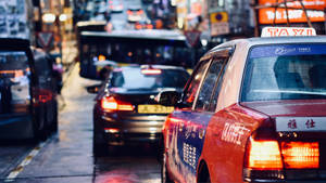 Hongkong Taxi On Wet Road Wallpaper