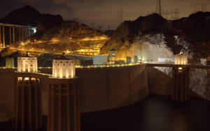 Hoover Dam With Lights At Night Wallpaper