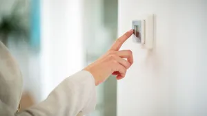 Human Hand Interacting With A Classic Light Switch Wallpaper