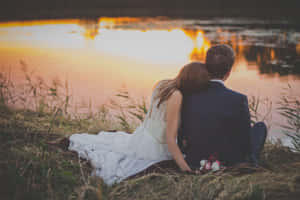 Husband And Wife Married By The Lake Wallpaper