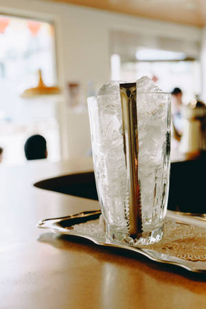 Ice Cube In Glass With Tong Wallpaper