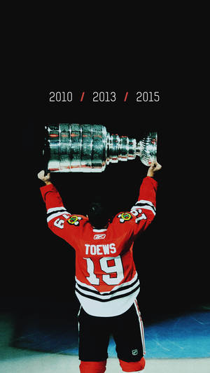 Ice Hockey Mvp - Jonathan Toews In Action In A High Intensity Game. Wallpaper