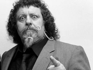 Iconic Wrestling Personality Pointing Wallpaper