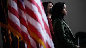 Ilhan Omar Beside The Us Flag Wallpaper