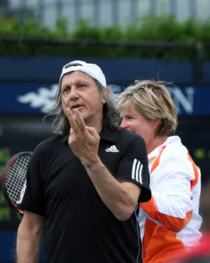 Ilie Năstase In Action During Us Open Exhibition Game Wallpaper