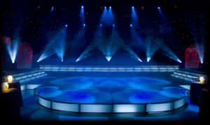 Illuminated Blue Concert Stage Design Wallpaper