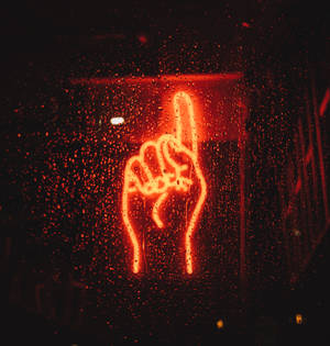 Illuminated Neon Sign Of An Index Finger Pointing Upwards Wallpaper