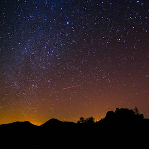 Illuminated Night Sky With Galactic View Wallpaper