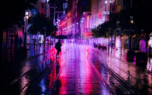 Illuminated Night Street Scene Wallpaper