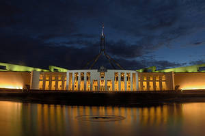 Illuminated Parliament House In Canberra At Night Wallpaper