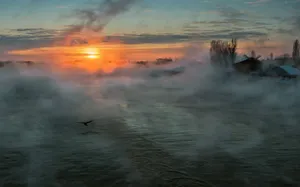 Image A Breathtaking Sunset Over A Foggy Cannabis Farm. Wallpaper
