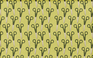 Image Scissors On A Green Patterned Background Wallpaper