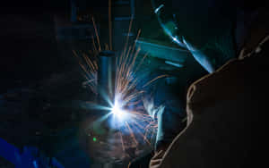 Image Welding Professionals In Action Wallpaper