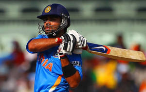 Indian Cricket Team Member Bat Swinging Wallpaper