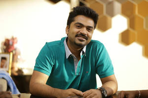 Indian Film Actor Simbu Posing With A Casual Polo Shirt. Wallpaper