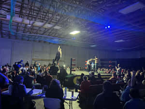 Indoor Wrestling Match Excitement Wallpaper