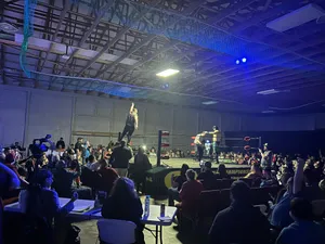 Indoor Wrestling Match Excitement Wallpaper