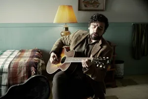 Inside Llewyn Davis Singing With Guitar Wallpaper