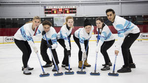 Intense Curling Game In Action Wallpaper