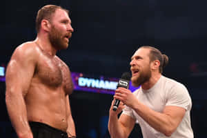 Intense Face-off: Jon Moxley And Bryan Danielson In The Ring Wallpaper