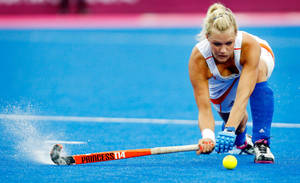 Intense Field Hockey Match Action Wallpaper