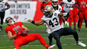 Intense Football Defensive Play Wallpaper