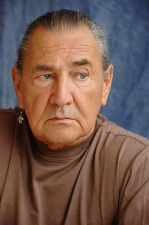 Intense Gaze Man Portrait Wallpaper