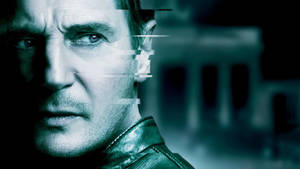 Intense Liam Neeson As Martin Harris In Unknown Movie Wallpaper