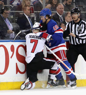 Intense Moment Of Brady Tkachuk In Ice Hockey Match Wallpaper