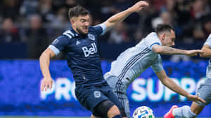 Intense Soccer Match Duel Wallpaper