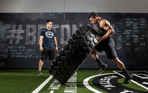 Intense Strength Exercise: Tyre Flip Wallpaper