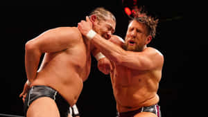 Intense Wrestling Match Elbow Strike Wallpaper