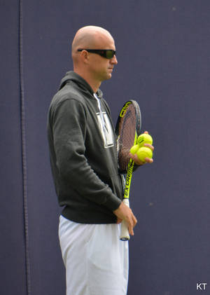 International Tennis Pro Ivan Ljubicic In Action Wallpaper