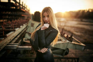 Intrepid Blonde Traveller On Railway Track Wallpaper