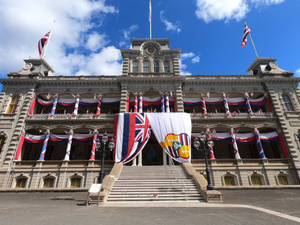 Iolani Palace Draped In Hawaiian Flag Wallpaper