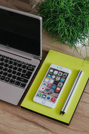 Iphone Desk With Bright Journal Wallpaper